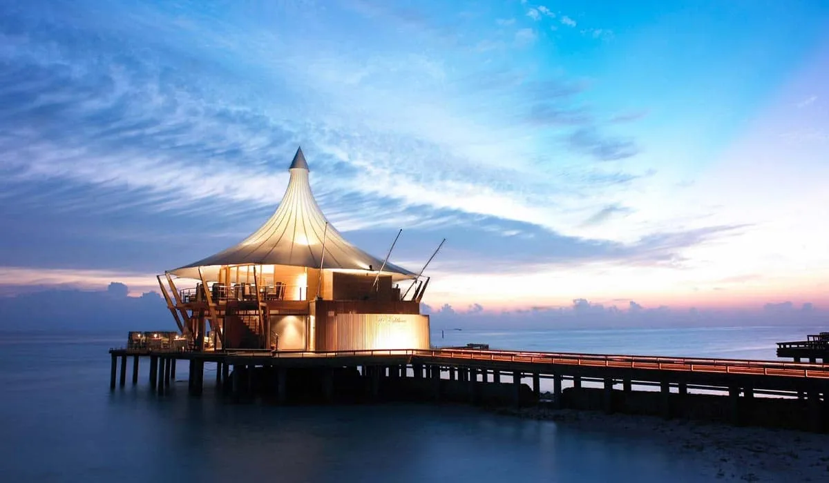 The Lighthouse restaurant on its jetty over the sea at dusk