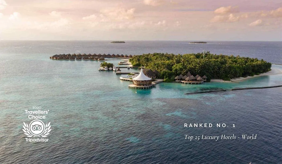 Aerial view of Baros with 2020 Tripadvisor Travellers' Choice badge: Ranked No. 1, Top 25 Luxury Hotels – World