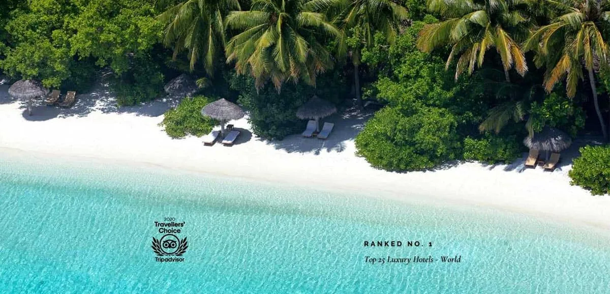 Aerial view of Baros beach with 2020 Tripadvisor Travellers' Choice badge: Ranked No. 1, Top 25 Luxury Hotels – World