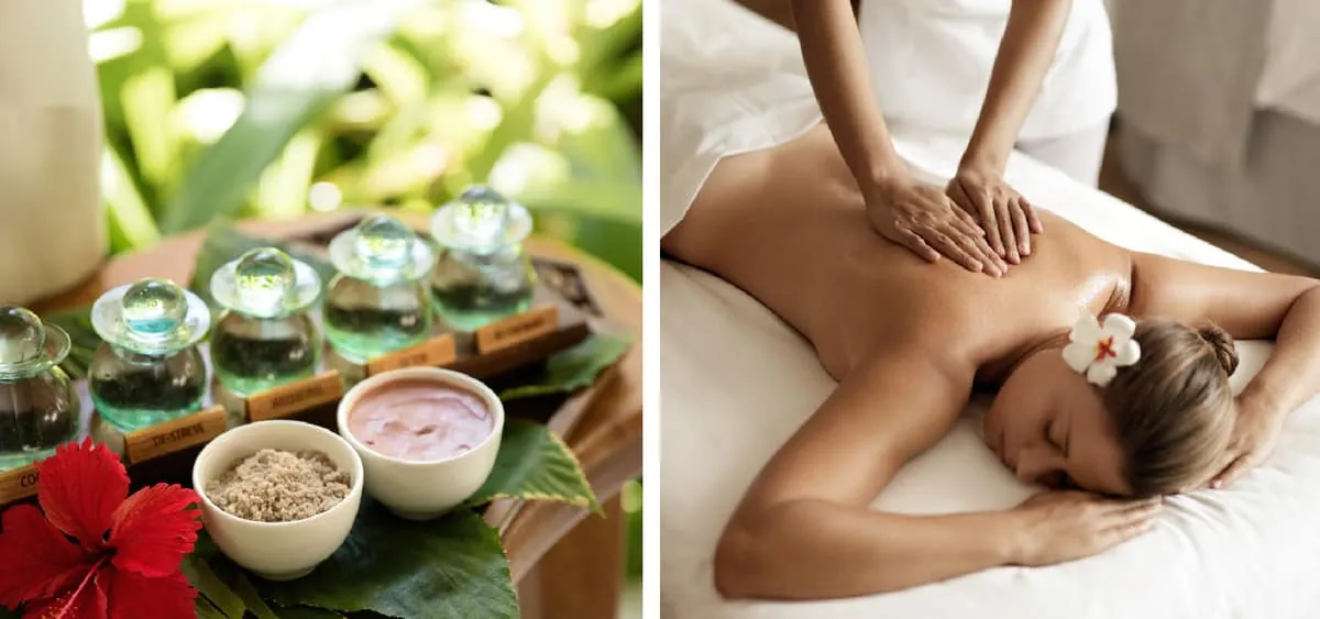 Spa oils and scrub bowls with a hibiscus beside a woman receiving a back massage
