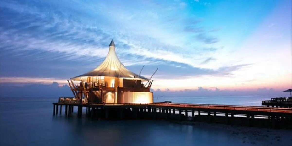 The Lighthouse Restaurant on its jetty above the sea at twilight
