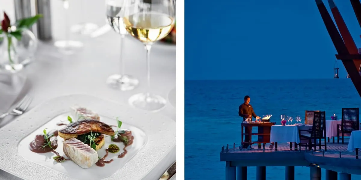 Plated fish dish with white wine, and a diner on the overwater deck at dusk