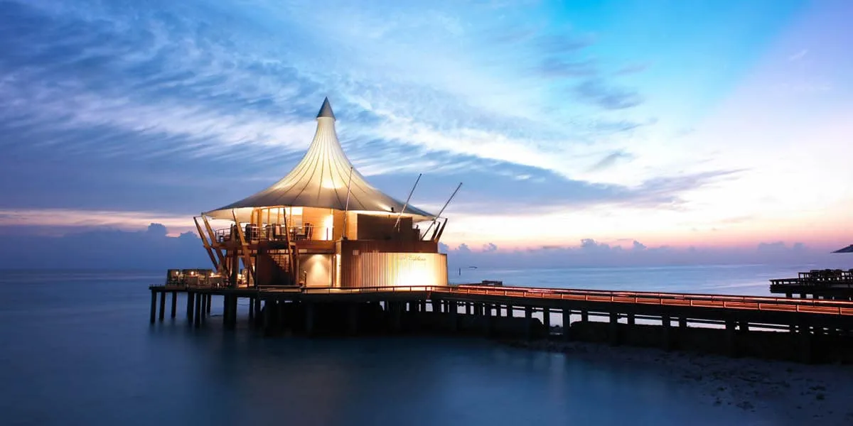 The Lighthouse Restaurant on its jetty above the sea at twilight