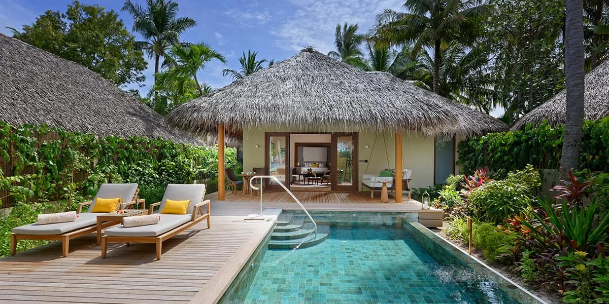 Baros Residence with a private pool, sun loungers and thatched roofs