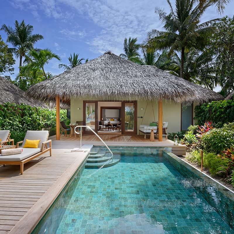 Exterior view of Baros Residence with a pool at Baros Maldives