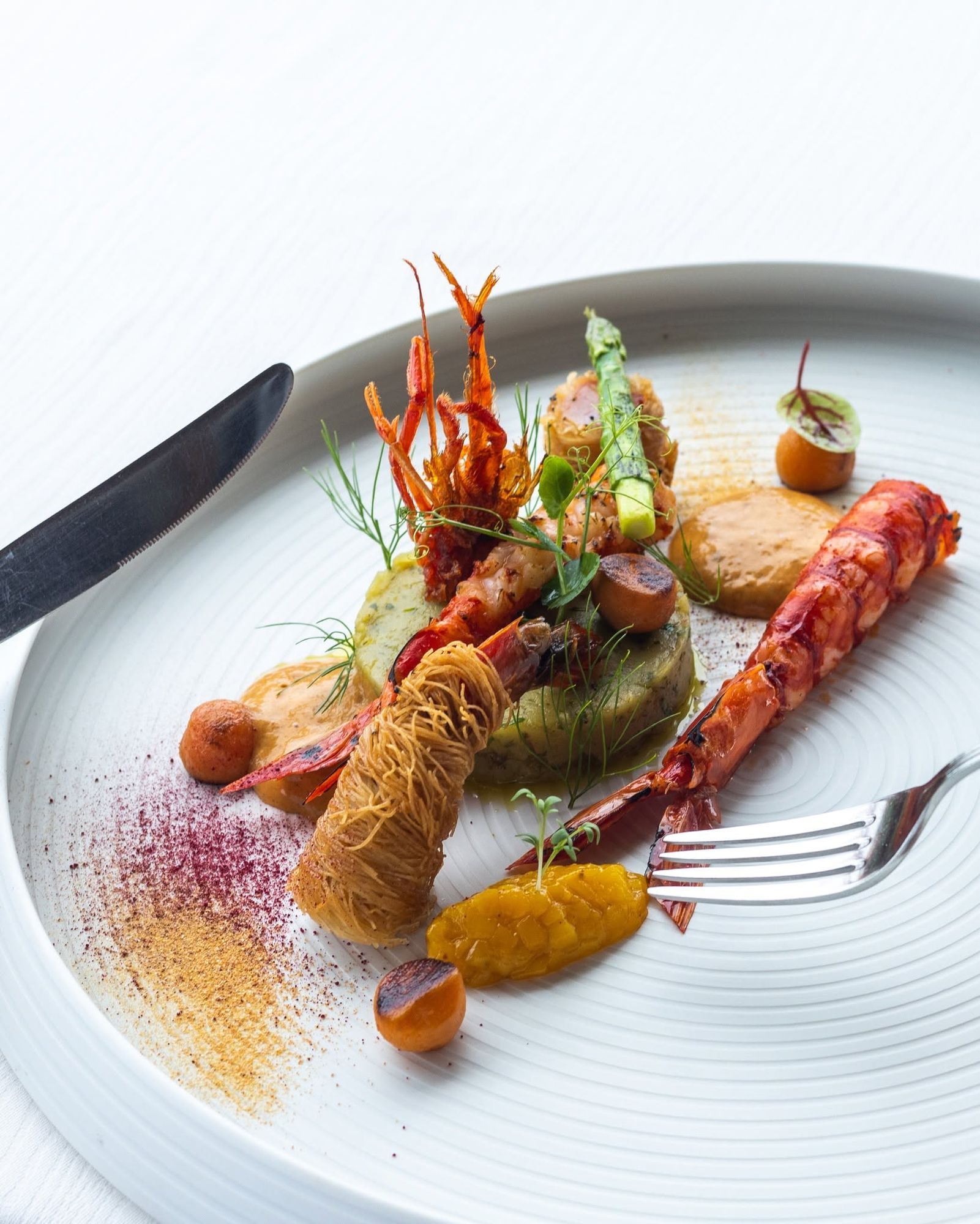 A plated seafood dish at Cayenne Grill