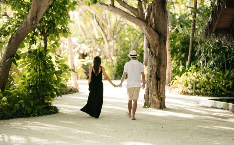 Walking in the sand and dappled light