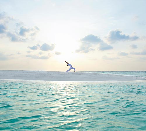 Man Doing Yoga in Maldives 