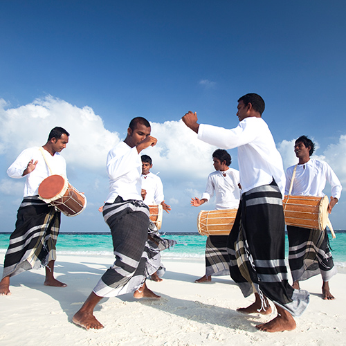 Drummers Performing on the Beach in Maldives 