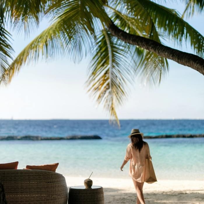 Women Walking on the Beach at Baros Maldives 