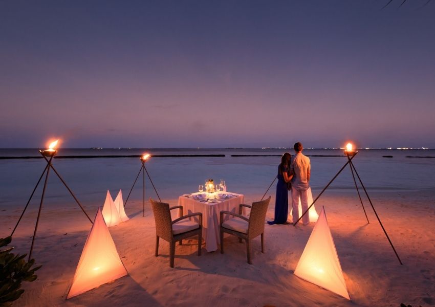 Couple Dining on a Private Island at Baros Maldives