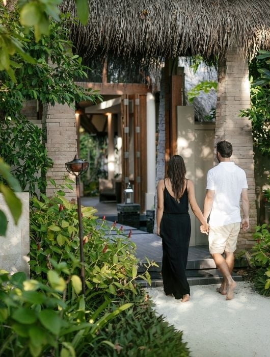 Couple Walking Through the Resort in Maldives 