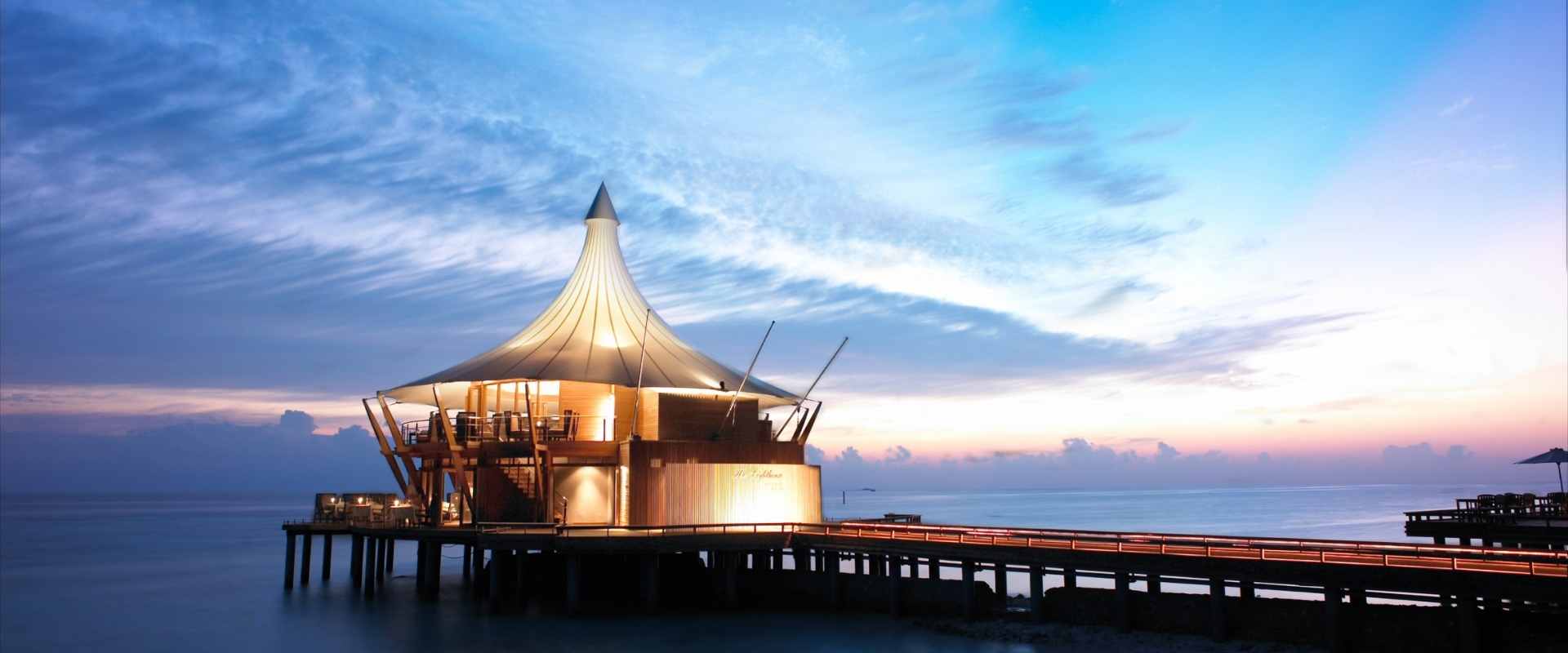 View of Lighthouse Restaurant over the lagoon during Dusk