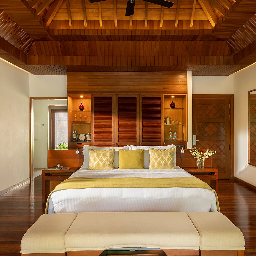 Interior bedroom of a pool villa at Baros Maldives