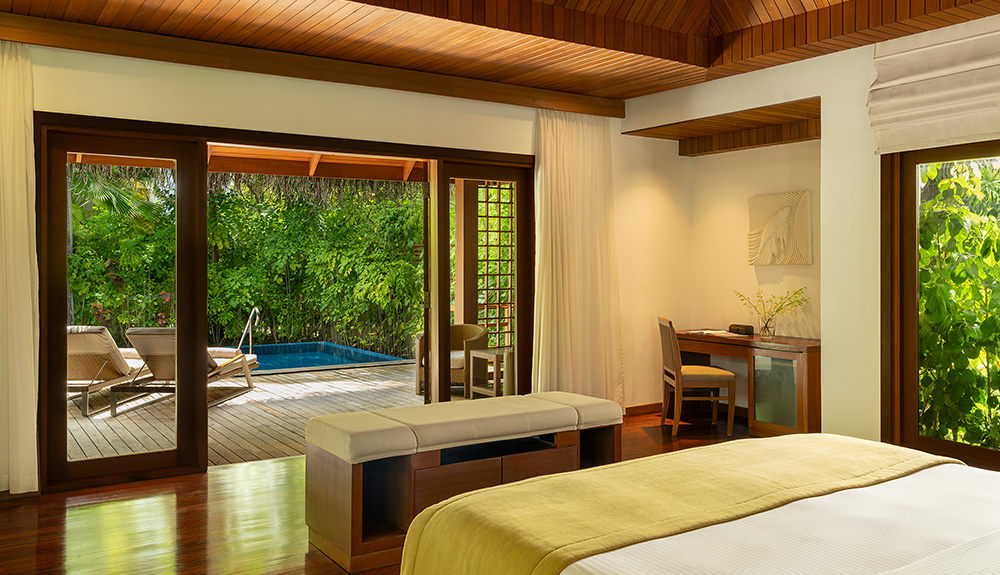 Interior of a pool villa bedroom at Baros Maldives