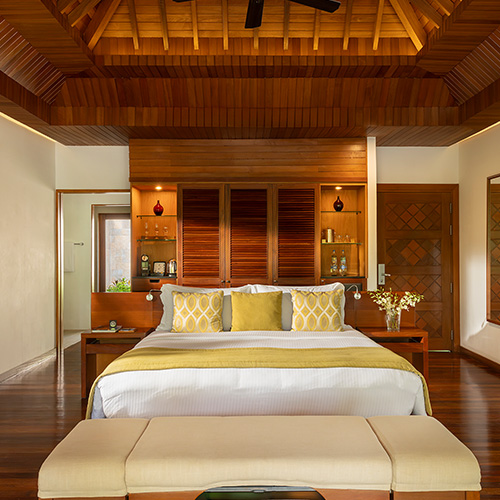 Interior bedroom of a pool villa at Baros Maldives