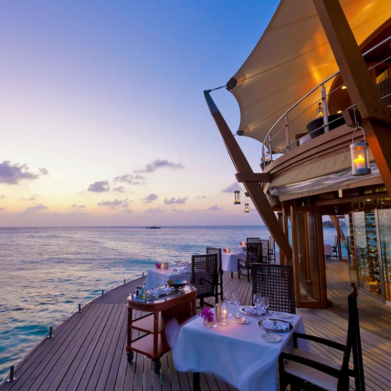Dining Area with Wooden Deck at Baros Maldives 