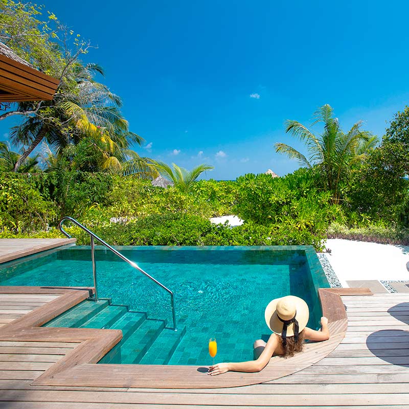Girl Relaxing in a Private Pool at Baros Maldives